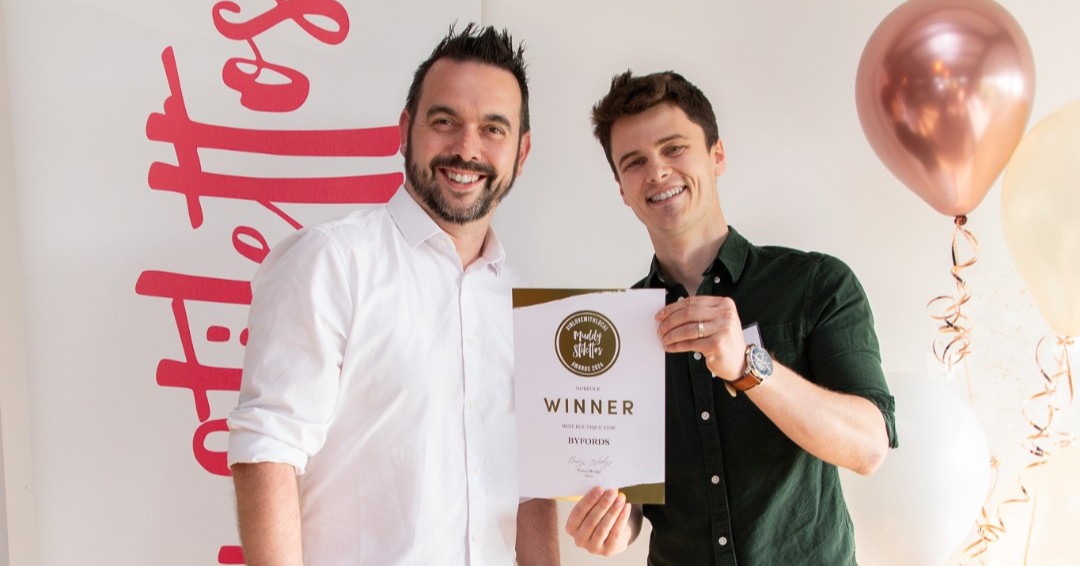 Directors Tom and Rich with the Muddy Award certificate.